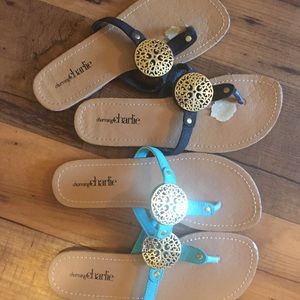 TWO PAIRS Flip flop sandals with gold medallions